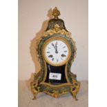 A late 19th century French mantel clock, the 7 cm diameter enamel dial with Roman numerals, fitted