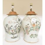 A pair of Chinese famille rose baluster vases, decorated figures, and foliage, the reverse with