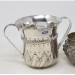 An early George III silver two handled porringer, with rococo style decoration, London 1768, approx.