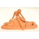 A Continental Art Deco style terracotta group, of a nude lady and two dogs, 27 cm high