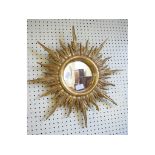 A giltwood sunburst mirror, 50 cm diameter