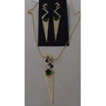 An Art Deco style gold plated pendant, on a chain, and a pair of matching drop earrings (2) Report