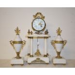 A late 19th century French clock garniture, the clock having an 8.5 cm diameter enamel dial with