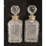 A pair of cut glass decanters, with French silver coloured metal collars, 24 cm high (2)