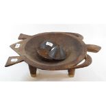 A Fijian carved hardwood bowl, of turtle shaped outline, on four peg feet, 50 cm wide, and 3 coconut