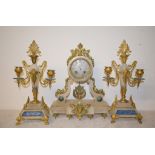 A late 19th century clock garniture, the clock having an 8 cm diameter dial with Roman numerals,