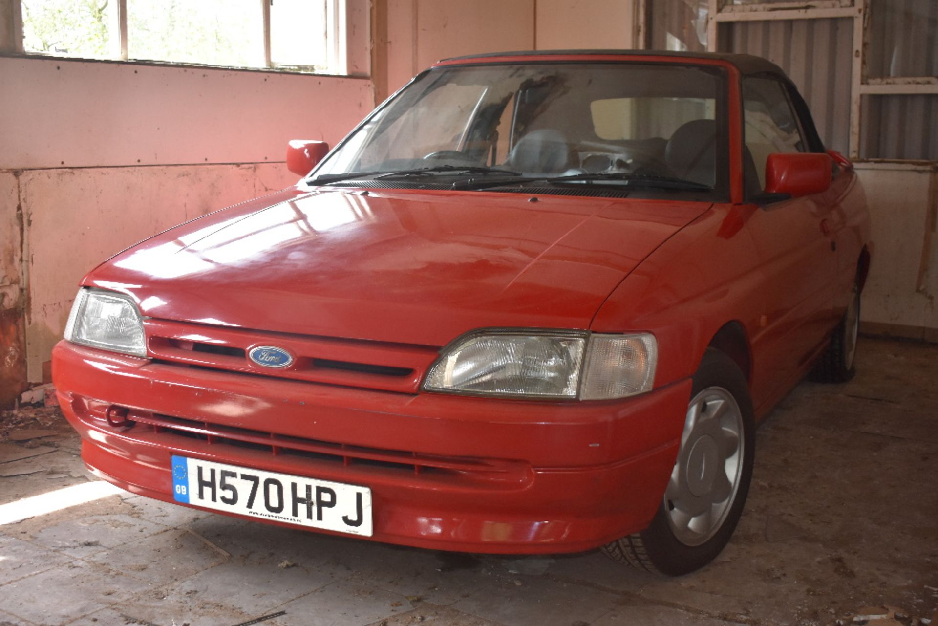 A 1991 Ford Escort Mk IV 1.6i cabriolet project, registration number H570 HPJ, red. This Mk IV