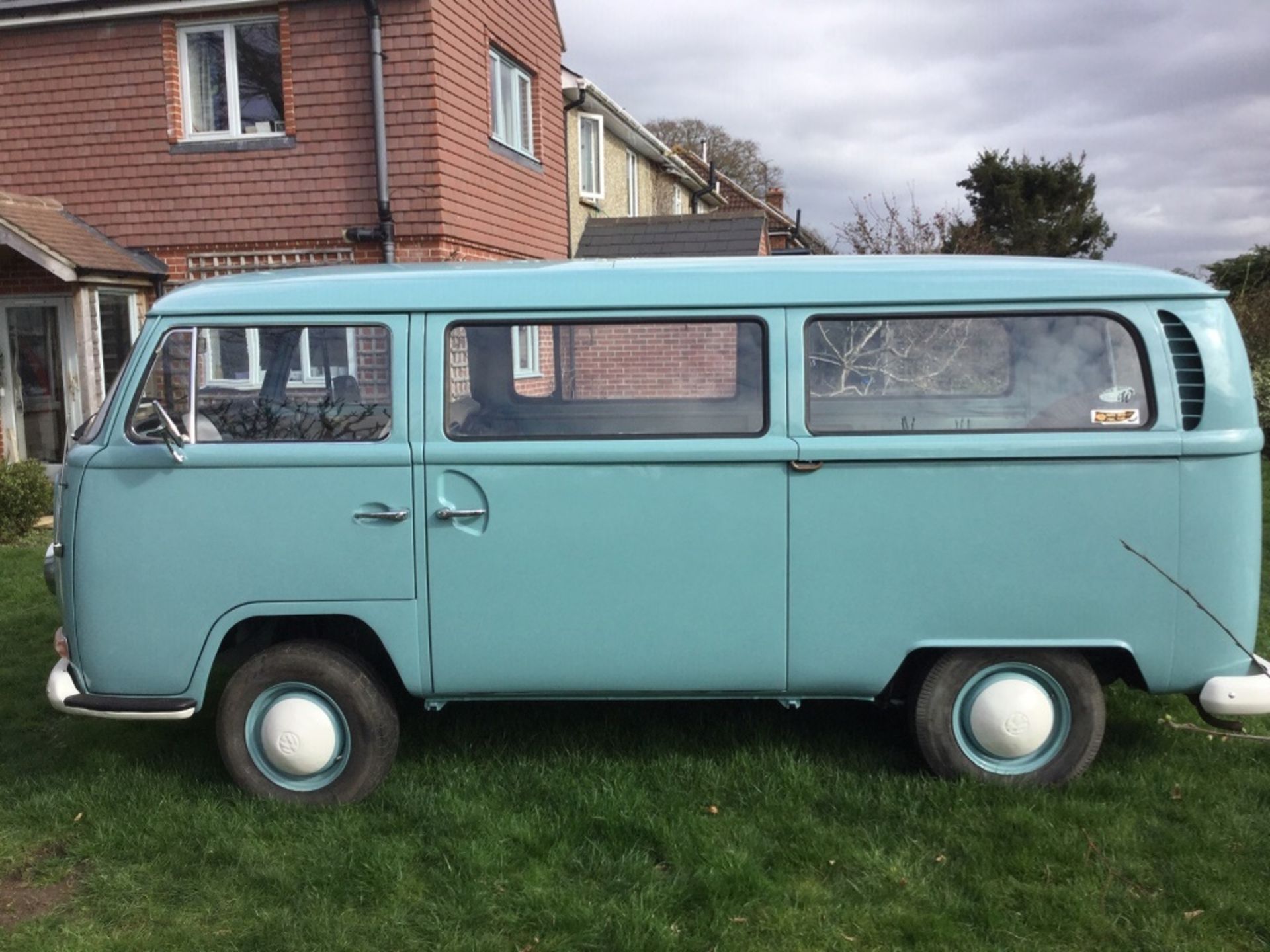 A 1969 Volkswagen T2 Combi, registration number SCV 883G, chassis number 239190234, blue.