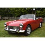 A 1967 MG Midget Mk III, registration number PLB 425E, red. The MG Midget is a no frills two seat