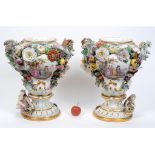 A pair of late 19th/early 20th century Dresden porcelain vases, painted classical figures, applied