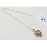 A 9ct gold, ruby and diamond set heart shaped locket on a chain Report by RB Modern
