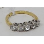 A five stone diamond ring, on a yellow coloured metal shank, approx. ring size O Report by NG It