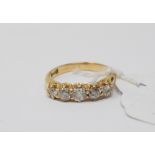 An 18ct gold and five stone diamond ring, approx. ring size M Report by NG It is approx. 3.5 g (