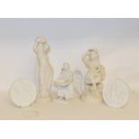 A Copenhagen Eneret angel, repaired, 21 cm high, and two similar roundels, a Parian ware figure,