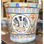 A large Continental majolica jardiniere, of tapering cylindrical form, decorated heraldic motifs, 39