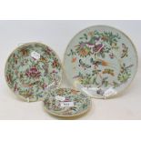 A Cantonese famille rose plate, decorated birds, butterflies and foliage, 22.5 cm diameter, and