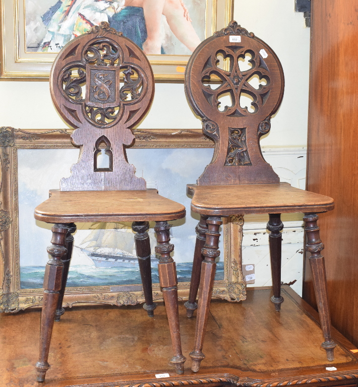 A matched pair of Victorian oak hall chairs (2)