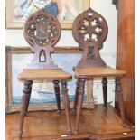A matched pair of Victorian oak hall chairs (2)
