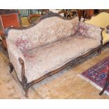 A late 19th century rosewood settee, carved flowers and foliage, on cabriole legs with knurl feet