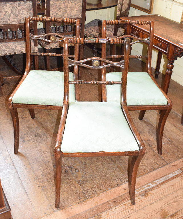 A set of six Regency style beech dining chairs, on sabre legs (6)