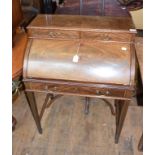 An Edwardian inlaid mahogany cylinder desk, on tapering square legs joined by a shaped undertier, 75