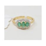 A 9ct gold, oval, emerald and diamond ring Report by RB Modern Report by GH Approx. ring size N