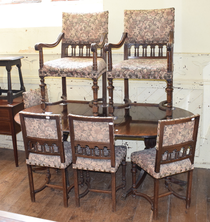 A set of six oak dining chairs, on turned front legs joined by shaped X stretchers (6 + 2), and a