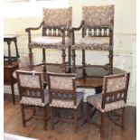 A set of six oak dining chairs, on turned front legs joined by shaped X stretchers (6 + 2), and a