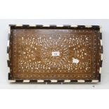 An Indian inlaid rosewood tray, decorated foliage, 46 cm wide Report by GH One crack to base.