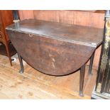 A George III mahogany dropleaf table, on pad feet, 140 cm wide