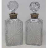 A pair of cut glass decanters, with French silver coloured metal collars, 24 cm high (2) Report by