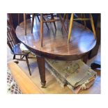 A mahogany oval extending dining table, with two extra leaves, 234 cm wide