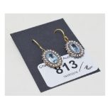 A pair of 9ct gold, silver, blue topaz and pearl earrings Report by RB Modern