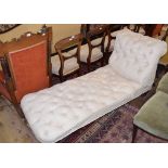 A Victorian upholstered day bed, on turned feet