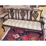 An 18th century style mahogany three chair back settee, with pierced vase shaped splats and cabriole