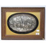 A Continental white metal oval relief panel, depicting Joan of Arc and her troops, signed Justin, 19