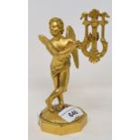 A gilt brass figure, of a cherub playing a lyre, 16 cm high