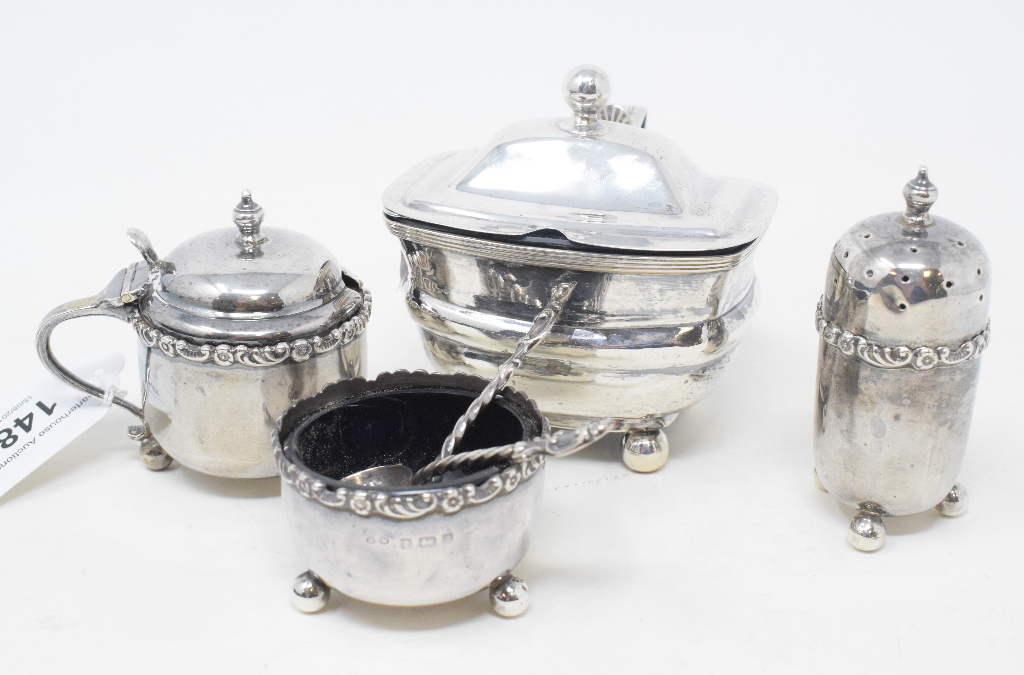 A silver mustard pot, Birmingham 1917, other silver condiments and two silver condiment spoons (6)