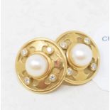 A pair of 18ct gold, diamond and pearl stud earrings