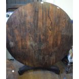 A Regency rosewood tilt top breakfast table, on a triform platform base, 137 cm diameter