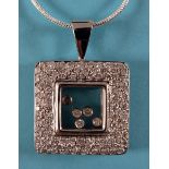 An 18ct white gold and diamond Chopard style pendant on chain See illustration