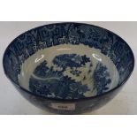 A Delft blue and white pottery charger, decorated flowers, chipped, 35 cm diameter, and a blue and