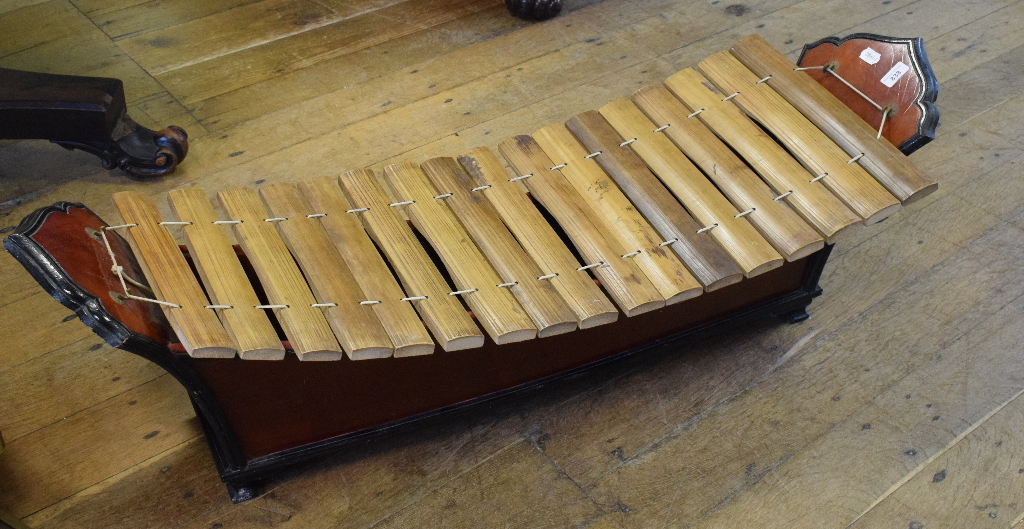 A Tibetan style xylophone, 120 cm wide