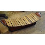 A Tibetan style xylophone, 120 cm wide