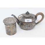 A silver teapot, with embossed decoration, London 1898, and a silver cylindrical box and cover, with
