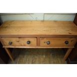 A stripped pine dresser base, with two frieze drawers, 134 cm wide