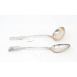 An early 19th century silver fiddle and thread pattern basting spoon, crested, London 1790,