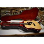 EXTRA LOT: An aria twelve string acoustic guitar, in a hard case