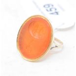 A 9ct gold and intaglio cut carnelian signet ring, approx. ring size O½