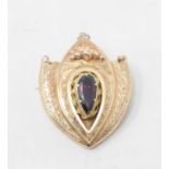 A 9ct gold heart shaped brooch, set a garnet
